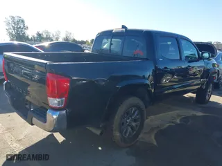 2017 Toyota Tacoma SR with VIN 5TFAX5GN5HX095074, listed as a IAAI auction lot 41814654 with 120,782 mi miles. Bid and sale history available at carsss.com. Image 4.