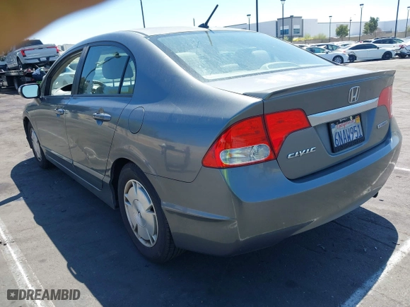 2010 Honda Civic Hybrid with VIN JHMFA3F29AS005350, listed as a IAAI auction lot 41966454 with 145,058 mi miles. Bid and sale history available at carsss.com. Image 3.