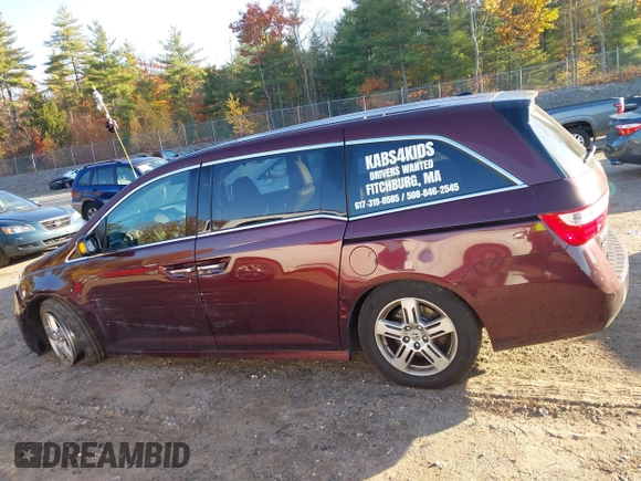 2012 Honda Odyssey Touring with VIN 5FNRL5H9XCB067841, listed as a IAAI auction lot 40631672 with 210,237 mi miles and . Bid and sale history available at DreamBid. Image 15.