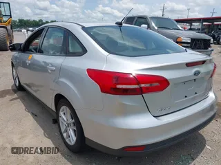 2016 Ford Focus SE with VIN 1FADP3F26GL351775, listed as a IAAI auction lot 42424733 with 164,886 mi miles and . Bid and sale history available at DreamBid. Image 3.