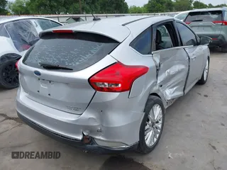 2015 Ford Focus Titanium with VIN 1FADP3N23FL356822, listed as a IAAI auction lot 41981053 with 115,584 mi miles and . Bid and sale history available at DreamBid. Image 4.