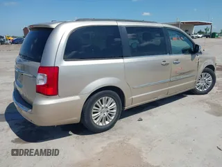 2013 Chrysler Town & Country Touring L with VIN 2C4RC1CG2DR767406, listed as a IAAI auction lot 42067814 with 75,985 mi miles and . Bid and sale history available at DreamBid. Image 4.