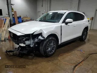 2021 Mazda CX-5 Touring z VIN JM3KFBCM8M0361684, wystawiony jako Copart lot #56049255 z przebiegiem 47 169 mil mil oraz Szkody całkowita. Historia ofert i sprzedaży dostępna na DreamBid. Obrazek 1.