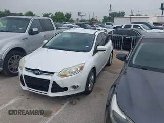 2012 Ford Focus SE with VIN 1FAHP3K21CL226992, listed as a IAAI auction lot 42036724 with 156,786 mi miles and . Bid and sale history available at carsss.com. Image 2.