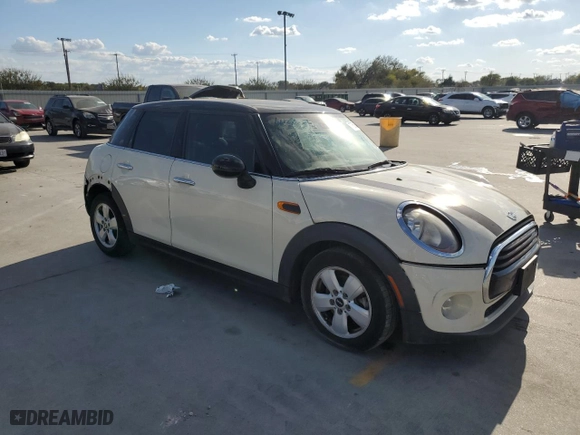 2016 MINI Cooper Hardtop 4 Door with VIN WMWXU1C57G2D13058, listed as a Copart auction lot 77658654 with 108,363 mi miles and Salvage Title. Bid and sale history available at carsss.com. Image 4.