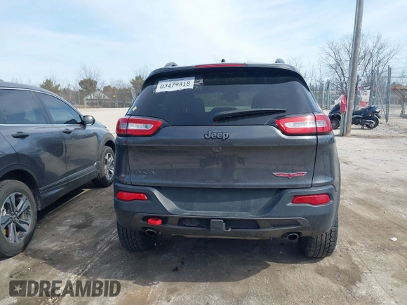 2015 Jeep Cherokee Trailhawk z VIN 1C4PJMBS3FW520328, wystawiony jako IAAI lot #41746017 z przebiegiem 83 485 mil mil oraz . Historia ofert i sprzedaży dostępna na DreamBid. Obrazek 17.