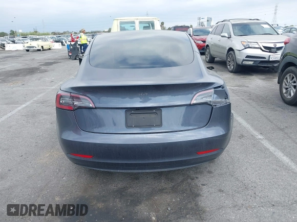 2023 Tesla Model 3 with VIN 5YJ3E1EA4PF410060, listed as a IAAI auction lot 42067624 with 59,934 mi miles and . Bid and sale history available at DreamBid. Image 16.