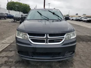 2013 Dodge Journey SE z VIN 3C4PDCAB7DT597063, wystawiony jako Copart lot #55896734 z przebiegiem 140 847 mil mil oraz Czysty tytuł • Clean title. Historia ofert i sprzedaży dostępna na DreamBid. Obrazek 5.
