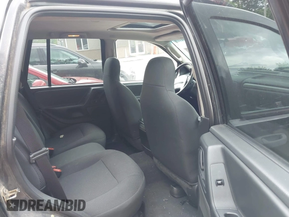 2004 Jeep Grand Cherokee Laredo with VIN 1J8GW48S94C357443, listed as a IAAI auction lot 42309958 with 176,738 mi miles and . Bid and sale history available at DreamBid. Image 8.