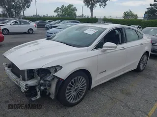 2013 Ford Fusion Titanium Hybrid with VIN 3FA6P0RUXDR386675, listed as a IAAI auction lot 42013986 with 89,349 mi miles. Bid and sale history available at carsss.com. Image 2.