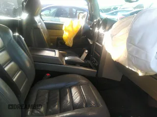 2003 Hummer H2 with VIN 5GRGN23U33H110037, listed as a IAAI auction lot 41339142 with 166,795 mi miles. Bid and sale history available at carsss.com. Image 5.