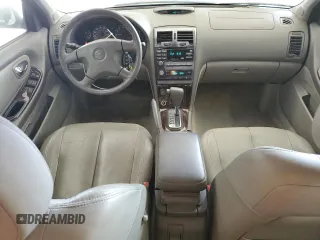 2000 Nissan Maxima GXE z VIN JN1CA31A1YT211725, wystawiony jako Copart lot #47401895 z przebiegiem 122 228 mil mil oraz Szkody całkowita. Historia ofert i sprzedaży dostępna na DreamBid. Obrazek 8.