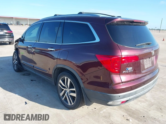 2017 Honda Pilot Touring with VIN 5FNYF5H96HB038413, listed as a IAAI auction lot 42594065 with 130,501 mi miles and . Bid and sale history available at DreamBid. Image 3.