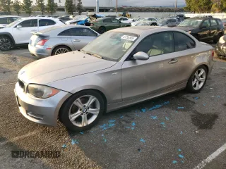 2009 BMW 1 Series 128i with VIN WBAUP93599VF49074, listed as a Copart auction lot 43756585 with 121,992 mi miles and Salvage title. Bid and sale history available at DreamBid. Image 1.