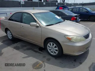 2002 Toyota Camry LE z VIN 4T1BE32K72U078387, wystawiony jako IAAI lot #42052328 z przebiegiem 157 394 mil mil oraz . Historia ofert i sprzedaży dostępna na DreamBid. Obrazek 1.