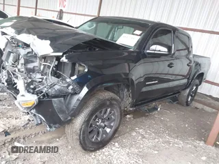 2023 Toyota Tacoma 4WD SR with VIN 3TMCZ5AN8PM538298, listed as a IAAI auction lot 41472145 with 66,484 mi miles. Bid and sale history available at carsss.com. Image 2.