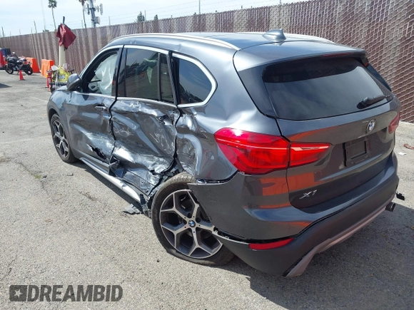 2018 BMW X1 xDrive28i with VIN WBXHT3C30J5L34702, listed as a IAAI auction lot 41935803 with 42,174 mi miles. Bid and sale history available at carsss.com. Image 3.