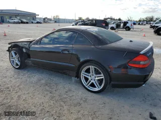 2009 Mercedes-Benz SL-Class V8 with VIN WDBSK71F09F144591, listed as a Copart auction lot 46873785 with 63,977 mi miles and Salvage Title. Bid and sale history available at carsss.com. Image 2.