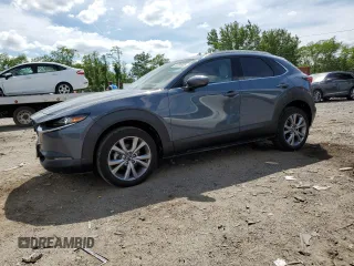 2021 Mazda CX-30 Premium z VIN 3MVDMBDL6MM310211, wystawiony jako Copart lot #57281605 z przebiegiem 24 042 mil mil oraz Szkoda całkowita • Salvage title. Historia ofert i sprzedaży dostępna na DreamBid. Obrazek 1.