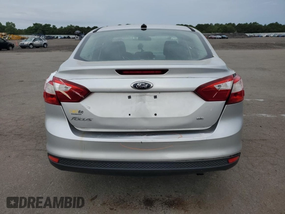 2012 Ford Focus SE with VIN 1FAHP3F2XCL202510, listed as a Copart auction lot 64066545 with 77,828 mi miles and Salvage title. Bid and sale history available at DreamBid. Image 6.