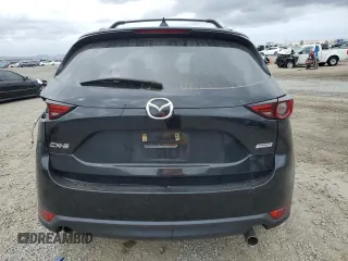 2018 Mazda CX-5 Grand Touring with VIN JM3KFADM3J1370114, listed as a Copart auction lot 54579585 with 65,513 mi miles and Salvage Title. Bid and sale history available at DreamBid. Image 6.