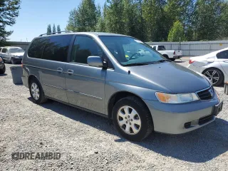 2002 Honda Odyssey EX-L with VIN 2HKRL18932H540391, listed as a Copart auction lot 65395405 with 119,239 mi miles and Clean title. Bid and sale history available at DreamBid. Image 4.