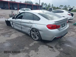 2018 BMW 4 Series 440i with VIN WBA4J5C57JBF07227, listed as a IAAI auction lot 41562986 with 76,316 mi miles and . Bid and sale history available at DreamBid. Image 3.