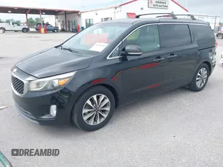 2015 Kia Sedona EX with VIN KNDMC5C11F6038255, listed as a IAAI auction lot 41968284 with 130,765 mi miles. Bid and sale history available at carsss.com. Image 2.