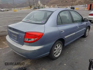 2003 Kia Rio with VIN KNADC125736236506, listed as a IAAI auction lot 41467649 with 109,975 mi miles. Bid and sale history available at carsss.com. Image 4.