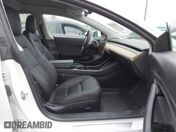 2020 Tesla Model 3 Standard Range Plus with VIN 5YJ3E1EA1LF799766, listed as a IAAI auction lot 41386508 with 90,000 mi miles. Bid and sale history available at carsss.com. Image 5.