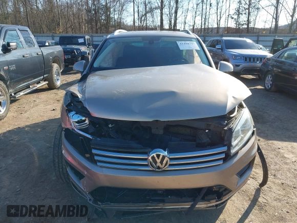 2016 Volkswagen Touareg Sport with VIN WVGEF9BP0GD003241, listed as a IAAI auction lot 41498797 with 90,141 mi miles and . Bid and sale history available at DreamBid. Image 12.