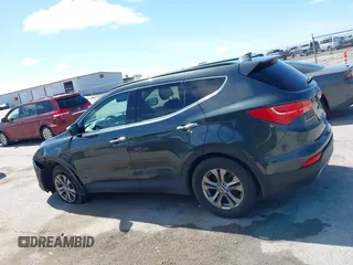2014 Hyundai Santa Fe with VIN 5XYZUDLB0EG187984, listed as a IAAI auction lot 42607599 with 111,594 mi miles and . Bid and sale history available at DreamBid. Image 14.