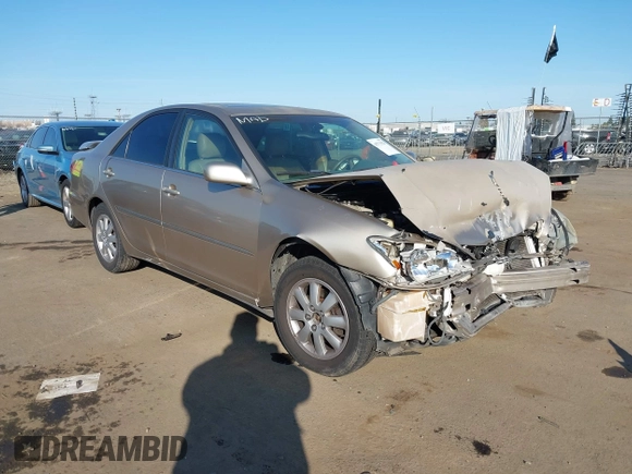 2004 Toyota Camry LE with VIN JTDBF32K140154908, listed as a IAAI auction lot 41773923 with 133,028 mi miles. Bid and sale history available at carsss.com. Image 1.