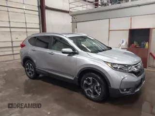 2017 Honda CR-V Touring with VIN 2HKRW2H90HH603307, listed as a IAAI auction lot 41868564 with 81,144 mi miles. Bid and sale history available at carsss.com. Image 1.
