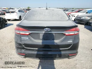 2017 Ford Fusion SE z VIN 3FA6P0H98HR179253, wystawiony jako Copart lot #52015345 z przebiegiem 99 883 mil mil oraz Czysty tytuł • Clean title. Historia ofert i sprzedaży dostępna na DreamBid. Obrazek 6.