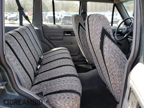 1993 Jeep Cherokee SE with VIN 1J4FJ28S0PL594889, listed as a Copart auction lot 50103425 with 174,333 mi miles and Salvage Title. Bid and sale history available at carsss.com. Image 11.