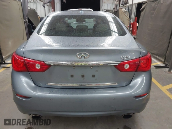 2015 Infiniti Q50 Premium z VIN JN1BV7AP6FM337369, wystawiony jako IAAI lot #41788419 z przebiegiem 106 977 mil mil oraz . Historia ofert i sprzedaży dostępna na DreamBid. Obrazek 16.
