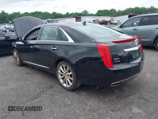 2013 Cadillac XTS Luxury z VIN 2G61P5S34D9183065, wystawiony jako IAAI lot #42665741 z przebiegiem 209 585 mil mil oraz . Historia ofert i sprzedaży dostępna na DreamBid. Obrazek 3.