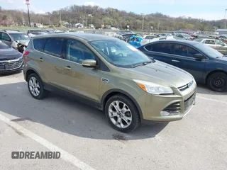 2013 Ford Escape SEL with VIN 1FMCU9H99DUC03956, listed as a IAAI auction lot 41891855 with 84,428 mi miles and . Bid and sale history available at carsss.com. Image 1.