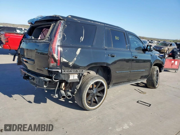 2015 Cadillac Escalade Premium z VIN 1GYS3NKJ3FR505290, wystawiony jako Copart lot #50048805 z przebiegiem Nie podano mil oraz Szkody całkowita. Historia ofert i sprzedaży dostępna na DreamBid. Obrazek 3.