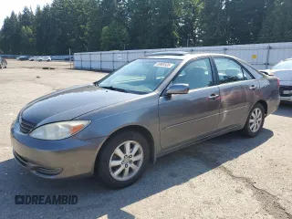 2002 Toyota Camry LE z VIN JTDBE32K520051569, wystawiony jako Copart lot #58908505 z przebiegiem 128 089 mil mil oraz Szkoda całkowita • Salvage title. Historia ofert i sprzedaży dostępna na DreamBid. Obrazek 1.