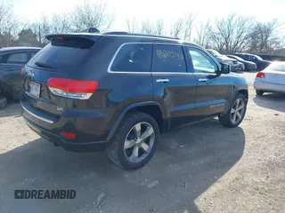 2014 Jeep Grand Cherokee Overland with VIN 1C4RJECG4EC523747, listed as a IAAI auction lot 40802143 with 124,079 mi miles. Bid and sale history available at carsss.com. Image 4.