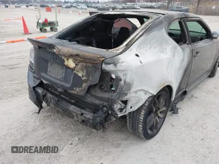 2015 Scion tC with VIN JTKJF5C72F3089756, listed as a IAAI auction lot 41554749 with 66,883 mi miles. Bid and sale history available at carsss.com. Image 6.