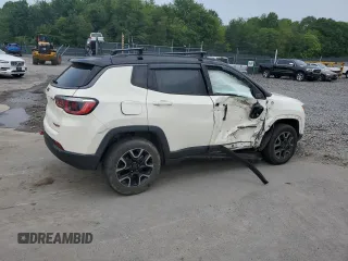 2019 Jeep Compass Trailhawk with VIN 3C4NJDDB5KT671613, listed as a Copart auction lot 61023125 with 64,793 mi miles and Salvage title. Bid and sale history available at DreamBid. Image 3.