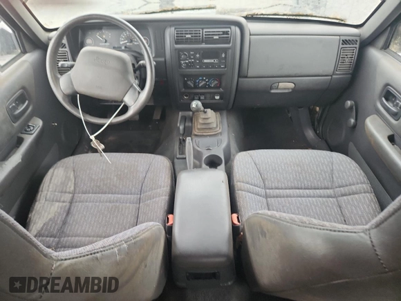 1999 Jeep Cherokee z VIN 1J4FF28P4XL560533, wystawiony jako Copart lot #59180605 z przebiegiem 190 262 mil mil oraz Czysty tytuł • Clean title. Historia ofert i sprzedaży dostępna na DreamBid. Obrazek 8.