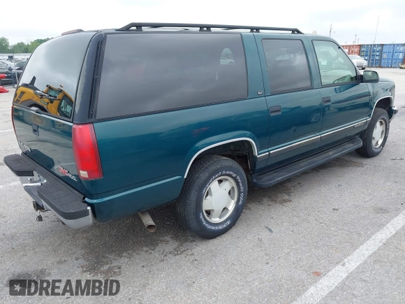 1996 GMC Suburban z VIN 1GKFK16ROTJ725925, wystawiony jako IAAI lot #42244433 z przebiegiem 123 837 mil mil oraz . Historia ofert i sprzedaży dostępna na DreamBid. Obrazek 4.