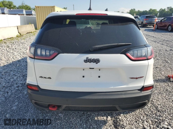 2020 Jeep Cherokee Trailhawk with VIN 1C4PJMBX8LD630827, listed as a Copart auction lot 61975455 with 142,716 mi miles and Clean title. Bid and sale history available at DreamBid. Image 6.