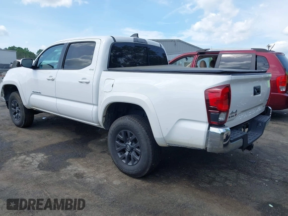 2021 Toyota Tacoma SR z VIN 5TFCZ5AN5MX265181, wystawiony jako IAAI lot #42077902 z przebiegiem 102 192 mil mil oraz . Historia ofert i sprzedaży dostępna na DreamBid. Obrazek 3.