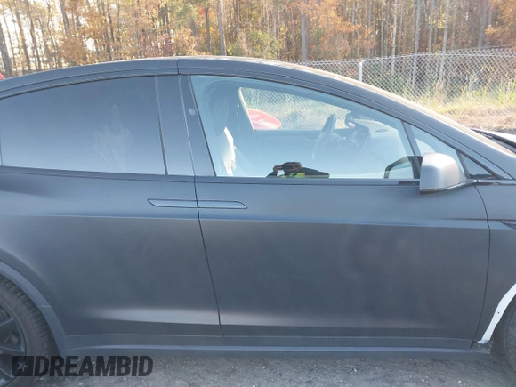 2020 Tesla Model X Long Range with VIN 5YJXCDE28LF298553, listed as a IAAI auction lot 40863184 with 54,031 mi miles and . Bid and sale history available at DreamBid. Image 13.