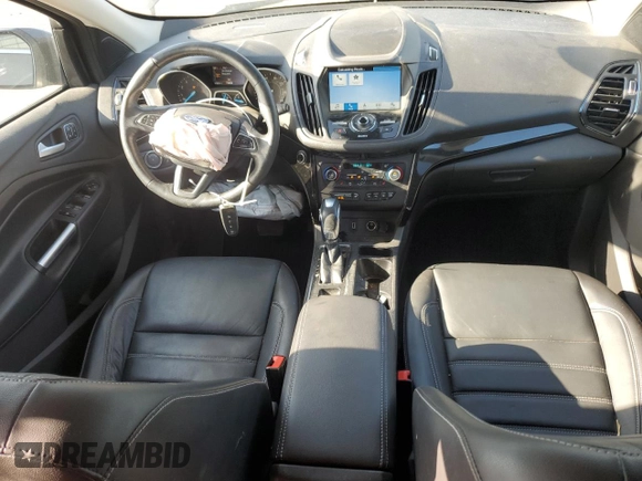 2019 Ford Escape Titanium with VIN 1FMCU0J96KUB22884, listed as a Copart auction lot 61979665 with 63,824 mi miles and Salvage title. Bid and sale history available at DreamBid. Image 8.